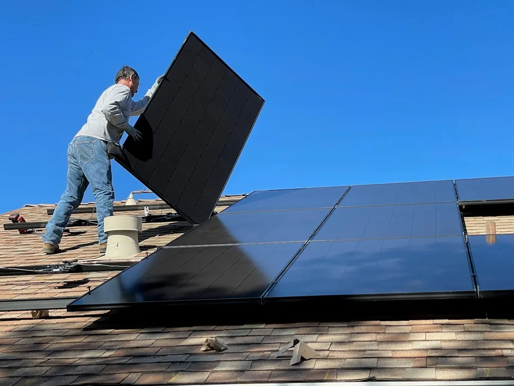 Solar panel installation process on a rooftop